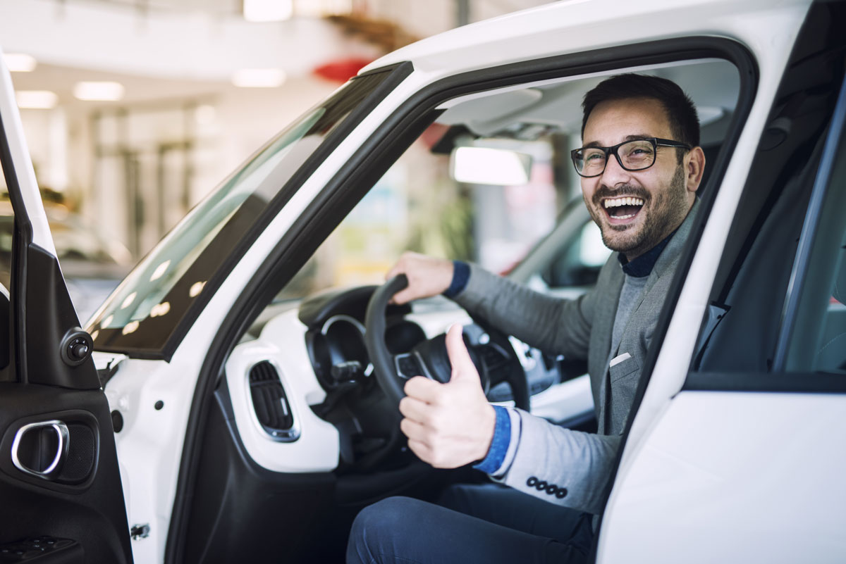 happy-satisfied-customer-just-bought-brand-new-car-vehicle-dealership